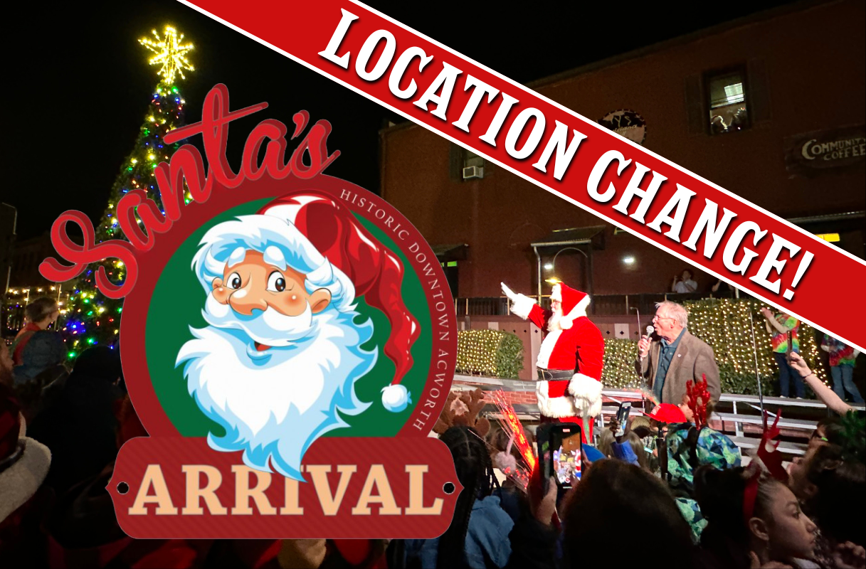 Crowd gathers at night near a lit Christmas tree as a man and Santa Claus wave onstage; a "Location Change!" banner and "Santa's Arrival" logo are overlaid on the image.