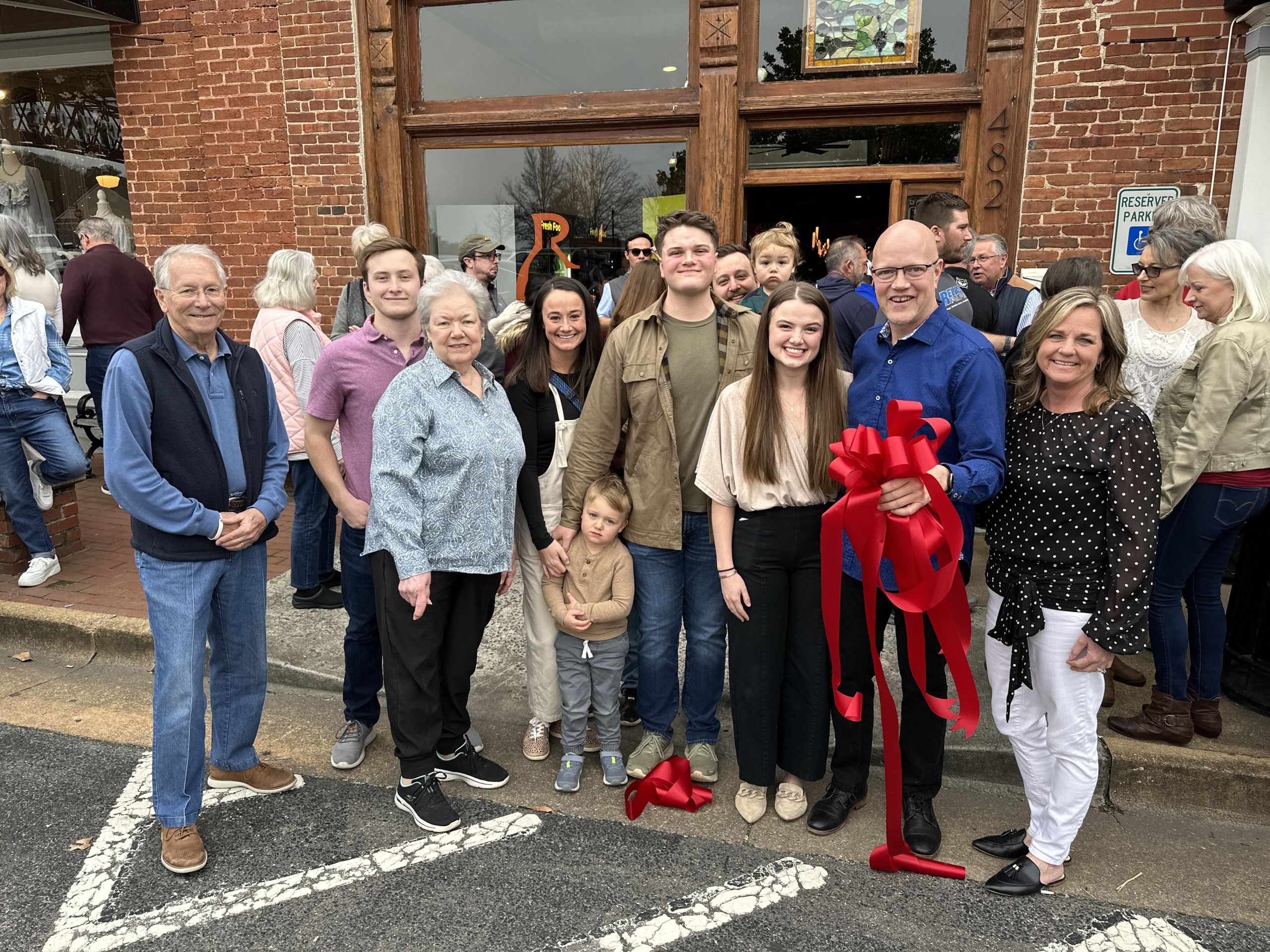 Image Toby Carmichael and Family with Mayor Allegood at TRG Vino Market Ribbon Cutting