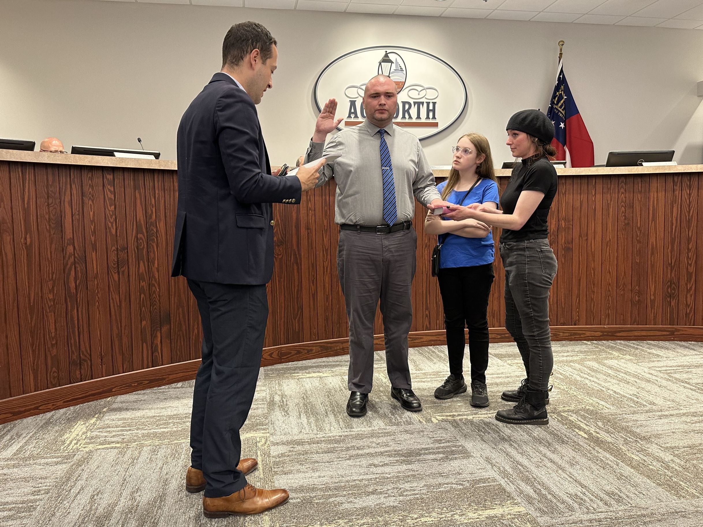 Image Alex Almodovar administering the Oath of Office to Code Compliance Coordinator Jacob Lonas at Acworth City Council Meeting