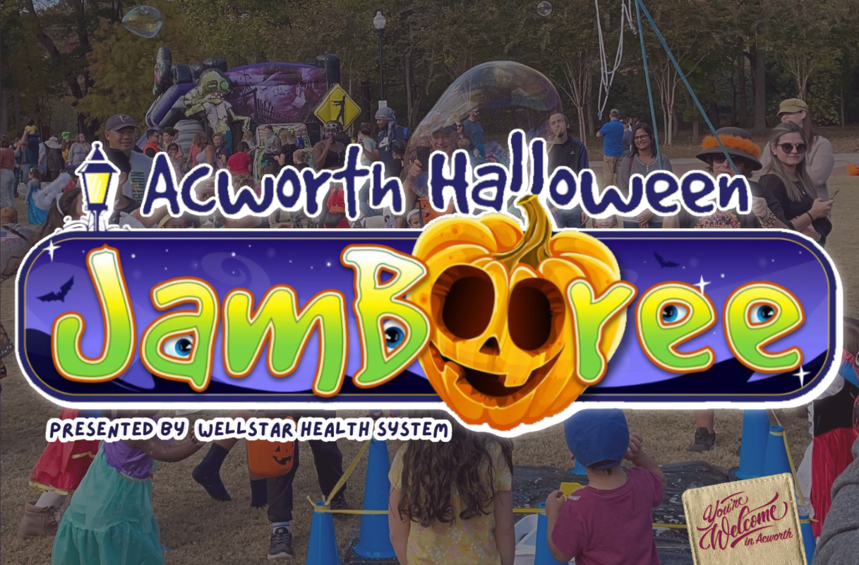 The Acworth Halloween Jamboree event sign is displayed over a festive outdoor gathering with adults and children in costumes.