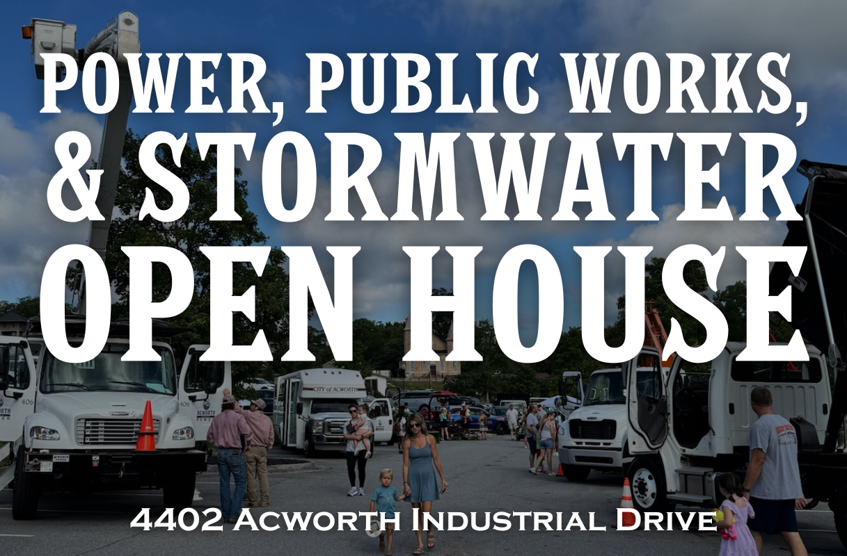 People walk among utility vehicles at an outdoor event for the Power, Public Works, and Stormwater Open House at 4402 Acworth Industrial Drive. Large white title text overlays the image.