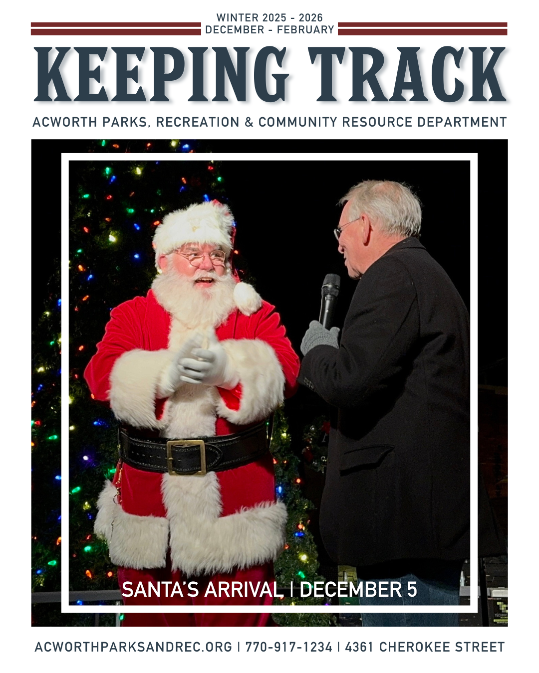 A man dressed as Santa Claus stands on stage next to another man holding a microphone, with a lit Christmas tree in the background. Text reads "Santa's Arrival | December 5.