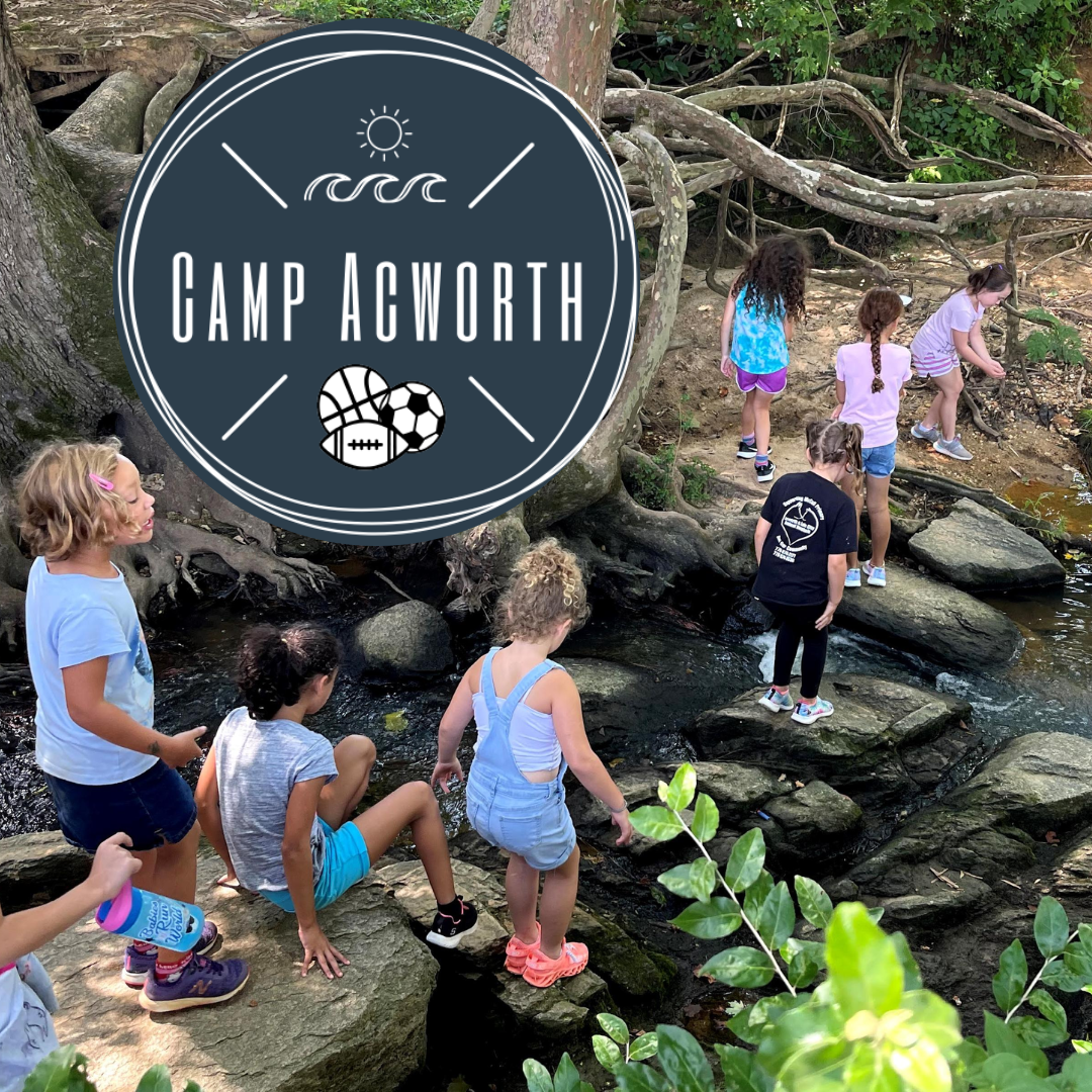 Children cross a shallow creek on rocks in a wooded area, exploring nature as part of the exciting camps and programs offered. A "Camp Acworth" sign with sun and sports icons is overlaid on the image.
