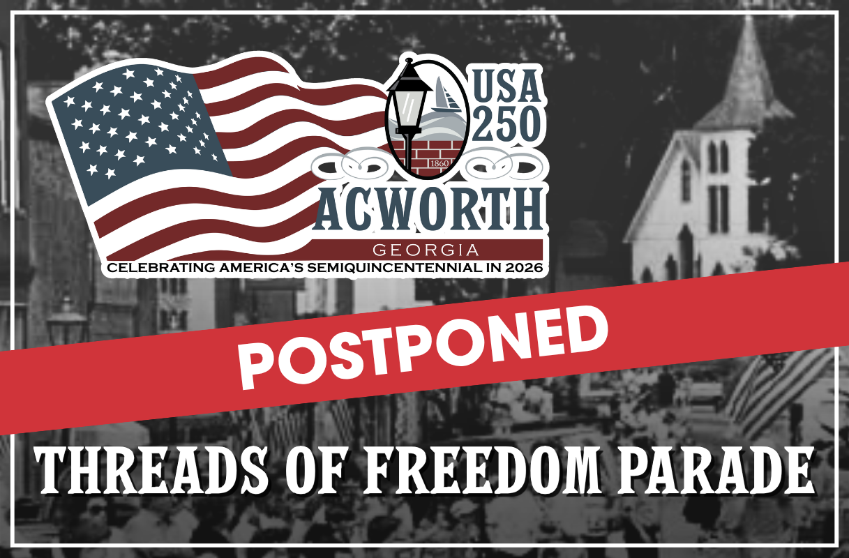 A banner announces the postponement of the Threads of Freedom Parade in Acworth, Georgia, part of the USA 250 Semiquincentennial celebration in 2026.